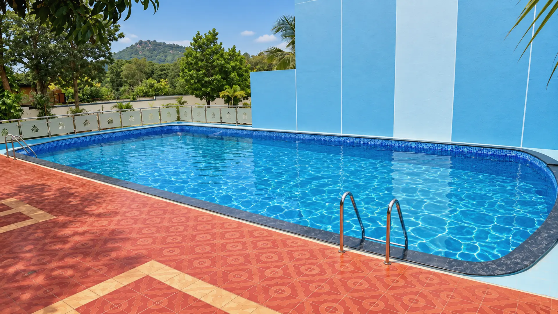 The pool at Hotel Hills Yelagiri at midday