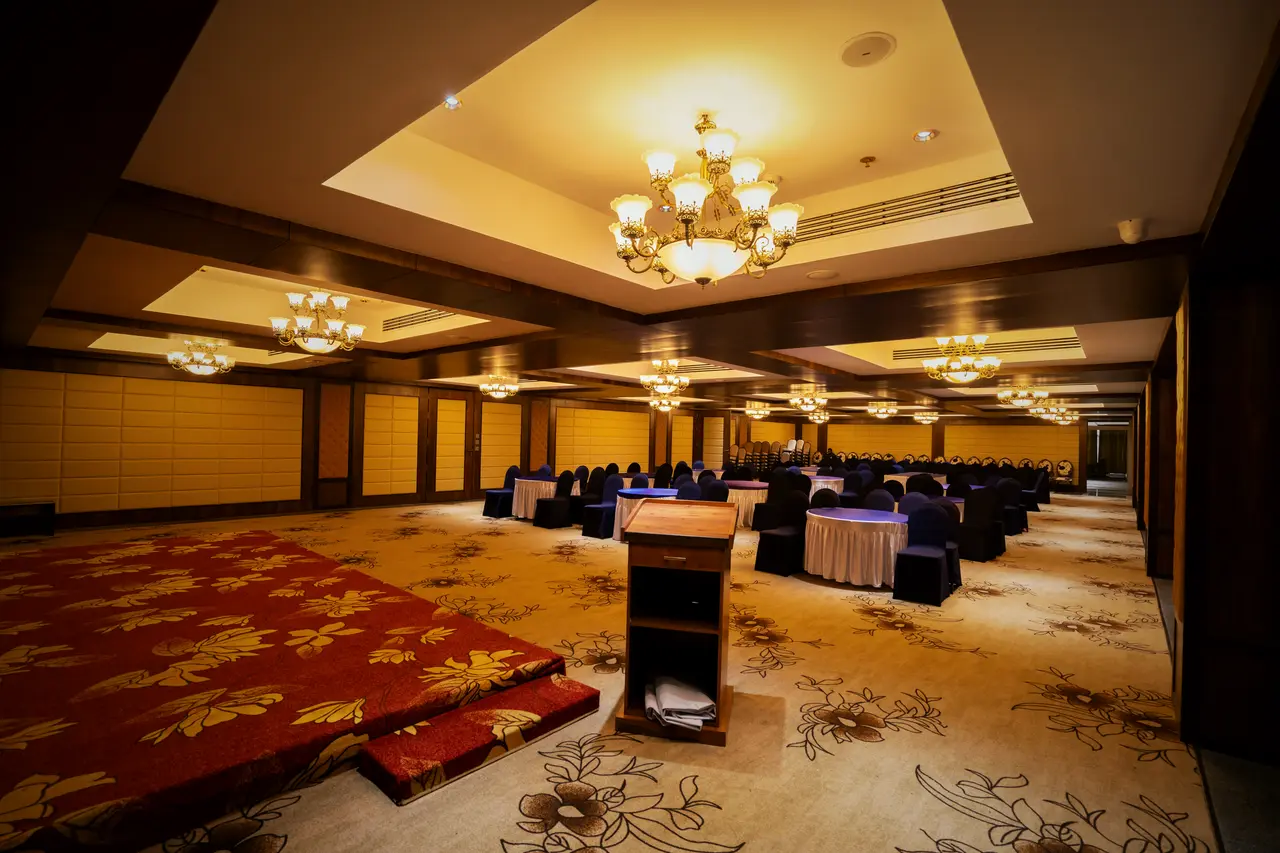 The stage end of the convention hall, a lectern on a red carpet
