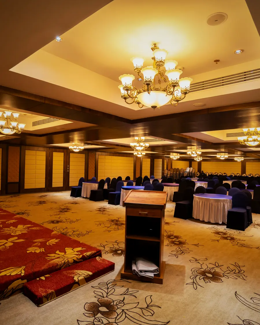 The convention hall at Hotel Hills Hosur, set for a function with the stage in