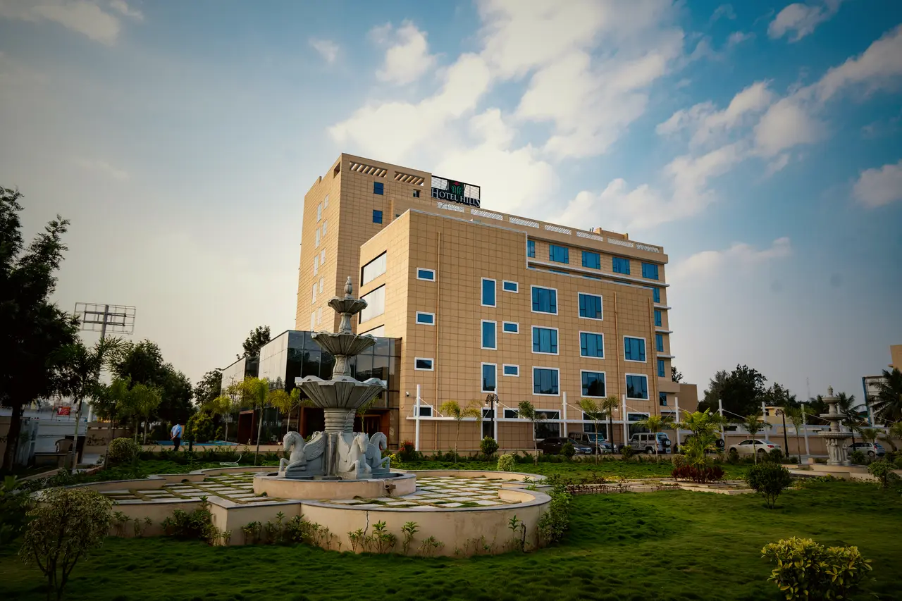 The lawn and fountain in front of the hotel