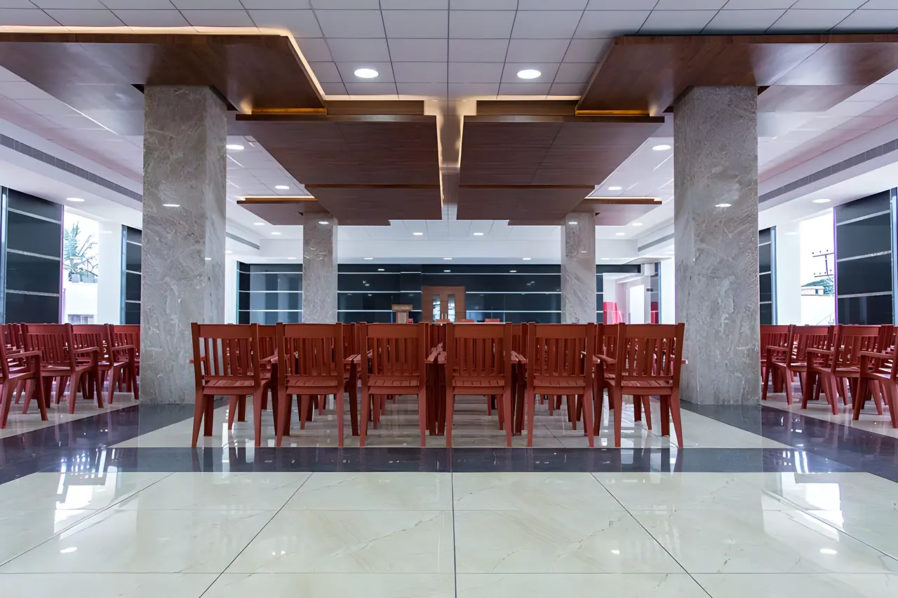 The banquet hall set with red chairs